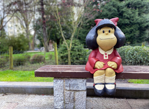 Oviedo, Spain - January 3, 2021: Statue of Mafalda character in Oviedo, Spain. It is a tribute to Quino and it is located at San Francisco park.