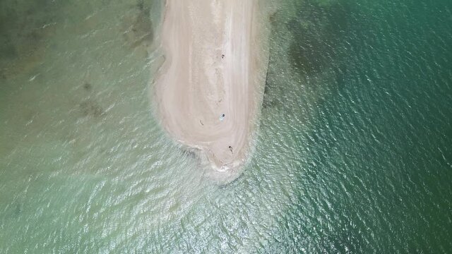 Ascending drone view of a sand bar in No Man Land, Tobago