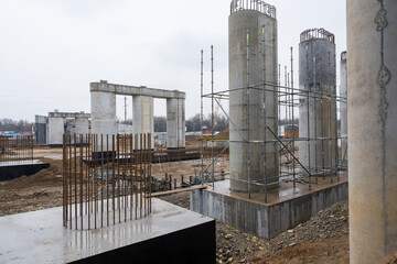 foundation, support with reinforcement of a column of a reinforced concrete transport bridge at a construction site with concrete columns