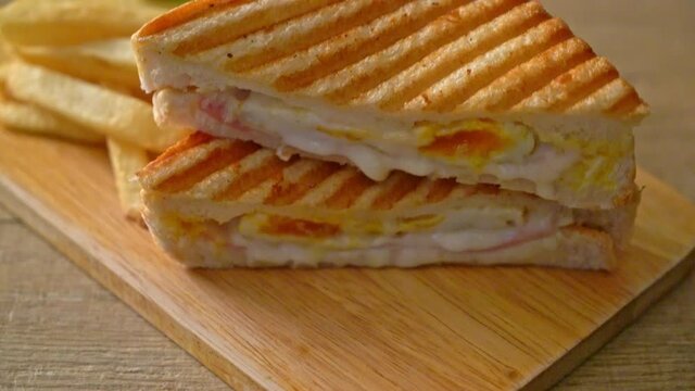 ham cheese sandwich with egg and fries