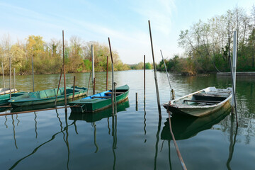Obraz premium Abandoned rowing boat, isolated on a lake. Three rowboat on water.