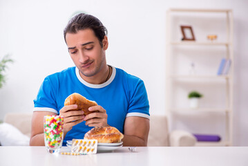 Young hungry man in dieting concept