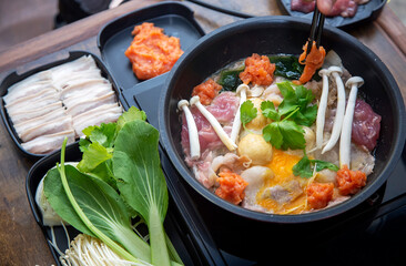 boiled meal mushroom seaweed and vegetable with egg on hot pan