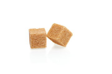 Brown cubes of cane sugar isolated on white background. Close up view.