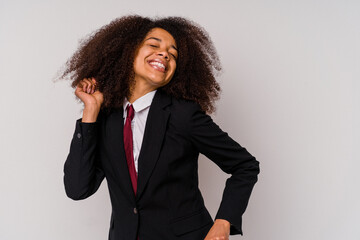 Young African American business woman wearing a suit isolated on white background dancing and having fun.