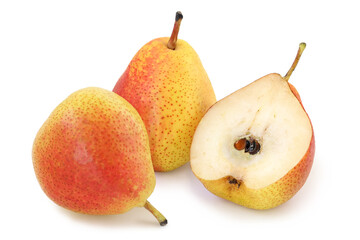 Two tasty red - yellow pears and half isolated on white