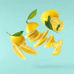 Naklejka na ściany i meble creative image with fresh lemons falling in the air, zero gravity food conception