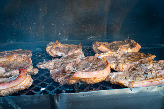 Jerk Pork Cooked In A Typical Caribbean Style BBQ Made From An Old Oil Drum