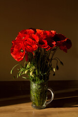 bouquet of red poppies on the floor