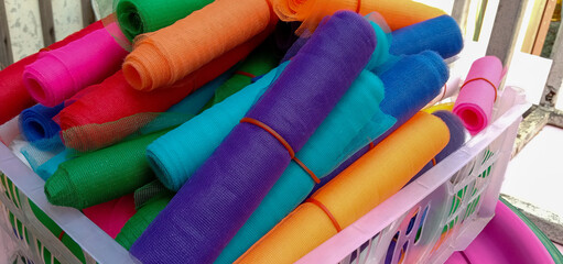 Colored cloth tied to the shrine on the basket