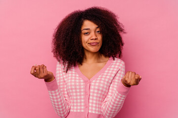 Young african american woman isolated on pink background showing that she has no money.