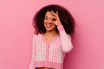 Young african american woman isolated on pink background excited keeping ok gesture on eye.