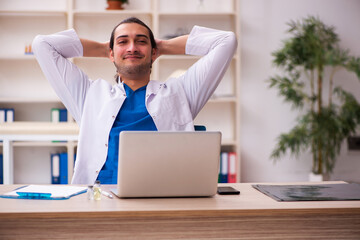 Young male doctor working in the clinic