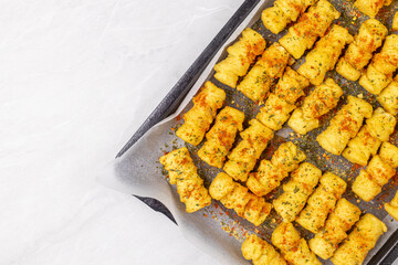 Potatoe croquettes on the baking tray ready for baking