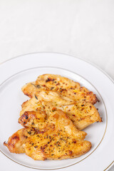 Delicious chicken breasts fried and served on the plate