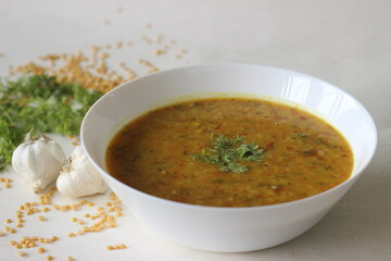 Boiled lentils tempered with garlic and spices. A favourite side dish from India popularly known as Yellow Daal Tadka.