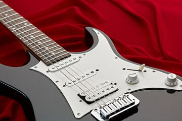 Modern electric guitar, red background
