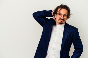 Young business man isolated on white background touching back of head, thinking and making a choice.