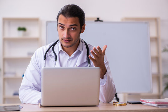 Young male doctor in telemedicine concept