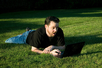 Man Working with Laptop in Park