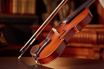 Violin in retro style and bow, closeup view
