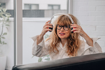 portrait of woman at home with headphones