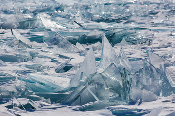 Scenic winter lake Baikal landscape with huge pressure ridge transparent ice blocks on the surface