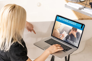 Back view of female talk consult with psychologist or colleague use webcam conference on laptop,...