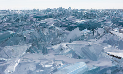 Scenic winter lake Baikal landscape with huge pressure ridge transparent ice blocks on the surface