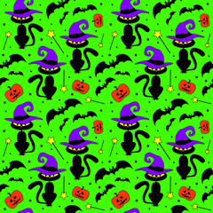 Black and colorful wizard cats, bats, pumpkins on green background seamless pattern. Vector halloween illustration.