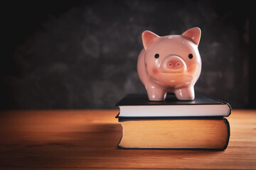 piggy bank  with a book on the table