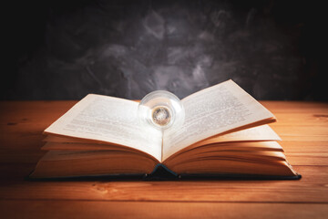 knowledge and wisdom, light bulb on the book