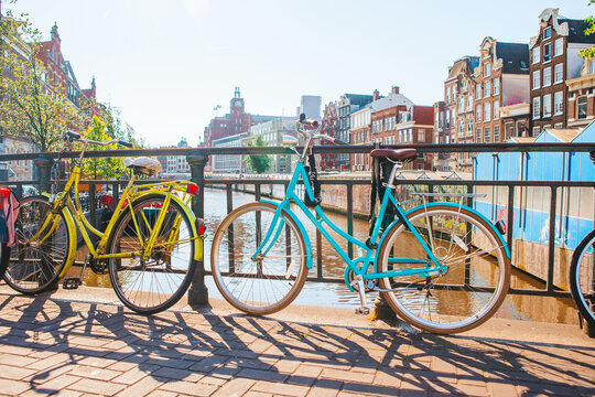 Bikes on the bridge in Amsterdam, Netherlands. Beautiful view of canals in autumn
