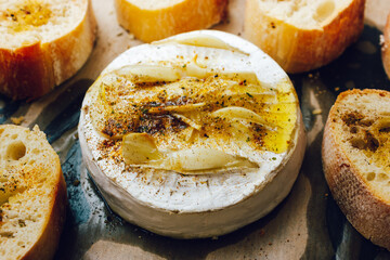 homemade DIY baked camembert with garlic.cheese with white mold.baked cheese.