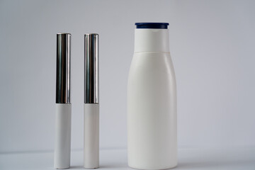 white jars with cosmetics on a white background