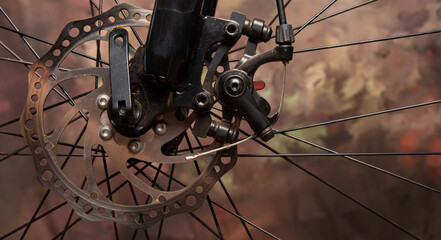 Fototapeta na wymiar Bicycle details, disc brake and spokes details, dark abstract background, selective focus.