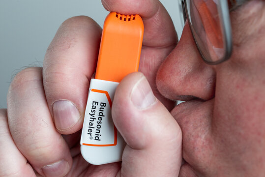 Budesonid Easyhaler in a hand when inhaling. For chronic bronchitis, asthma and, according to the latest findings, for COVID-19, SARS-CoV-2 infection	