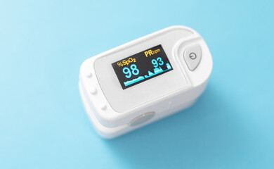 Pulse oximeter used to measure oxygen saturation in blood.