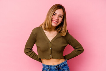 Young caucasian woman isolated on pink background happy, smiling and cheerful.