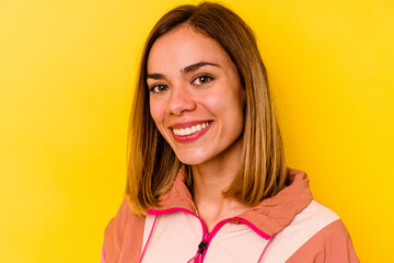 Young caucasian woman wearing invisible orthodontics isolated on yellow background