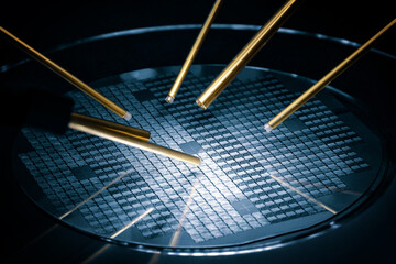 Close up of examining of test sample of microchip transistor under the microscope in laboratory....