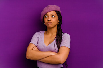 Obraz na płótnie Canvas Young african american woman isolated on yellow background Young african american woman isolated on yellow background tired of a repetitive task.
