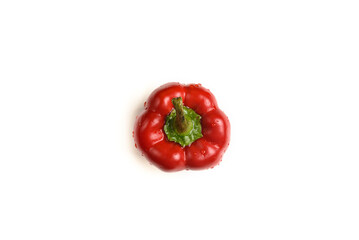  One sweet red pepper with water droplets isolated on a white background