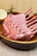 raw lamb chops with different ingredients