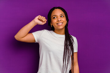 Young african american woman isolated on yellow background celebrating a victory, passion and enthusiasm, happy expression.