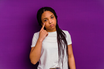 Young african american woman isolated on yellow background crying, unhappy with something, agony and confusion concept.