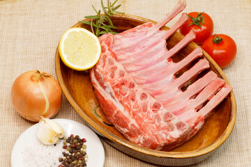 raw lamb chops with different ingredients