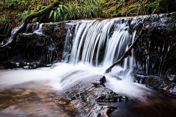 Fototapeta na wymiar waterfall in the forest scotland landscapes