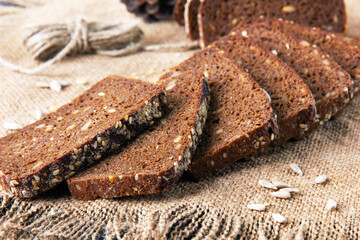 Slices of rye bread baked with sunflower seeds and linseeds.