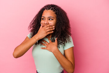 Young african american woman isolated on pink background suffers pain in throat due a virus or...